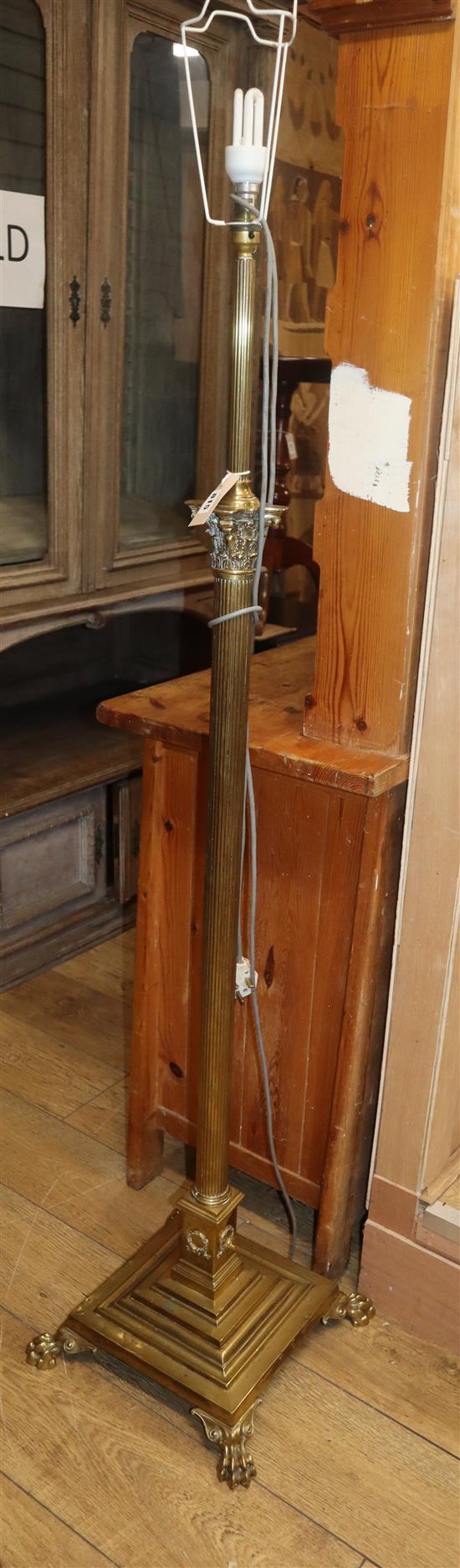 A brass Corinthian column adjustable standard lamp